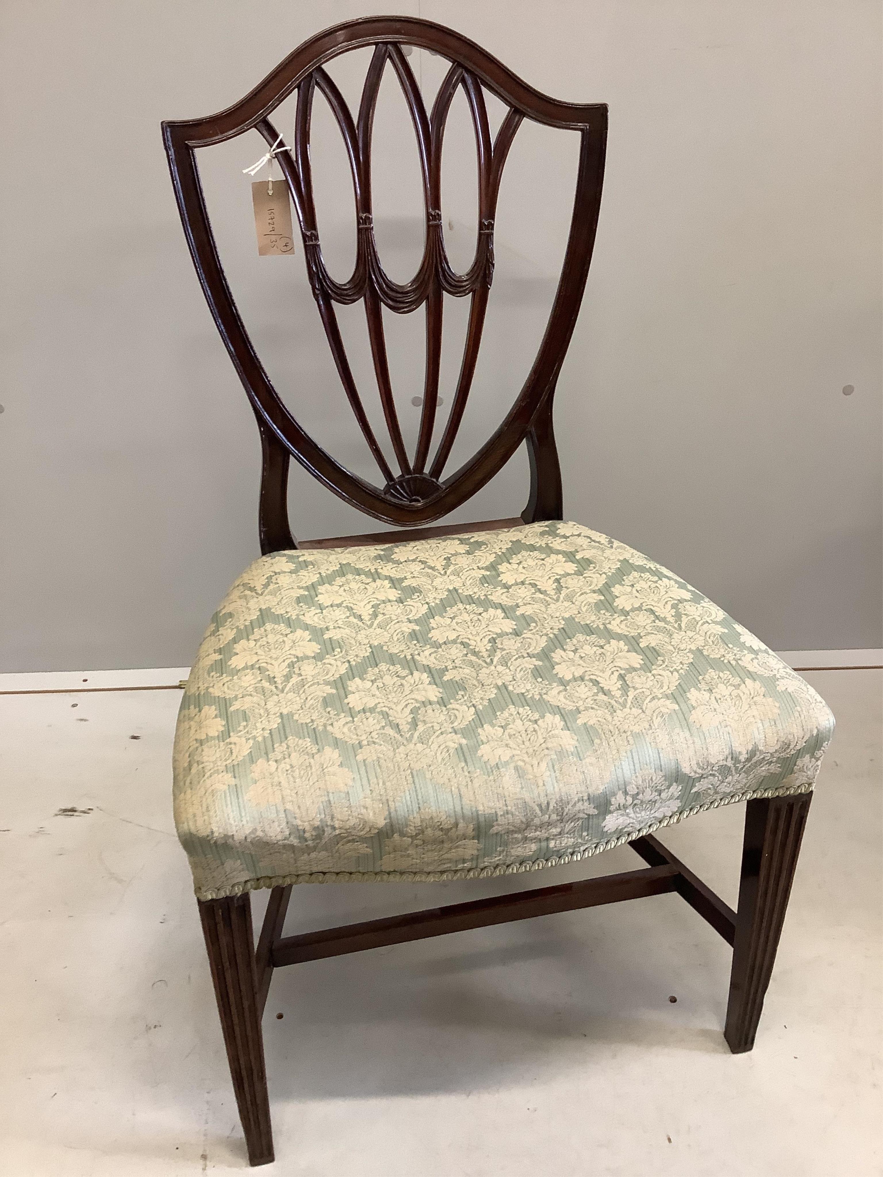 A pair of George III Sheraton style mahogany dining chairs and a pair of George III style mahogany elbow chairs. Condition - good